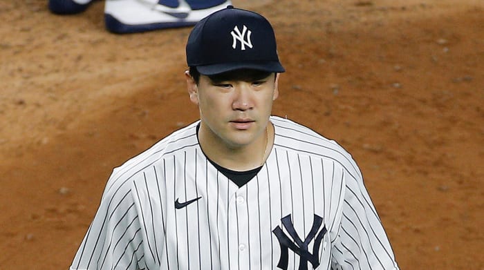 New York Yankees starting pitcher Masahiro Tanaka (19) leaves the mound after being taken out of the game against the Tampa Bay Rays during the fifth inning at Yankee Stadium.